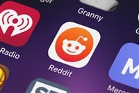 London, United Kingdom - September 29, 2018: Close-up shot of reddit's popular app Reddit: Trending News.