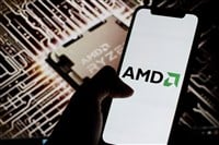 AMD logo is displayed on smartphone screen with chip AMD Ryzen in background. — Stock Editorial Photography