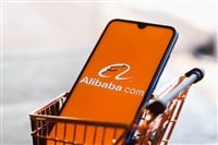 Brazil. In this photo illustration the Alibaba.com logo displayed on a smartphone along with a shopping cart