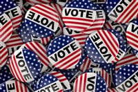 Photo of a pile of American voting pins.