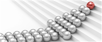 Photo of silver balls making the shape of an arrow, with a red ball at the tip; symbolizing how leadership can increase company value