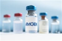 Vials of liquid on a white table and the logo Amgen, large pharmaceutical company. March 15, 2021. Barnaul, Russia.