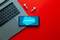 Kyoto city, Japan - July 31, 2023: Salesforce.com displayed on a smartphone near modern laptop on red background — Stock Editorial Photography