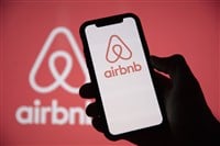 LONDON, UK - May 15 2020: Airbnb home holiday rental logo on a smartphone screen