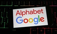 Viersen, Germany - July 9. 2023: Closeup of mobile phone on computer keyboard with logo lettering of Google Alphabet holding company