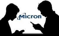 Photo of two silhouetted people on their smartphones with the Micron logo between them. 