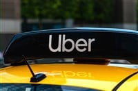 Uber logo icon on top of yellow taxi cab, close up - Moscow, 09//09/2020 — Stock Editorial Photography