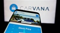 Stuttgart, Germany - 10-18-2024: Mobile phone with website of US used car retailing company Carvana Co. on screen in front of business logo. Focus on top-left of phone display. — Stock Editorial Photography