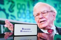 Berkshire Hathaway company and Warren Buffett in background. December 5, 2024 — Stock Editorial Photography