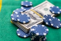 Poker chips and dollar Money bills on green cloth. High quality photo - stock image