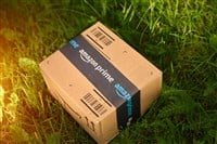 Quick delivery Amazon Prime package on grass 13.09.2024 Europe, Poland - Stock Editorial Photography