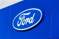 Ford motor company logo on dealership building — Stock Editorial Photography