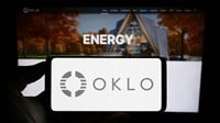 Stuttgart, Germany - 07-21-2023: Person holding smartphone with logo of US fission reactor company Oklo Inc. on screen in front of website. Focus on phone display. — Stock Editorial Photography