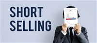 Photo of a businessman holding a financial graph in front of his face, standing next to the words Short Selling