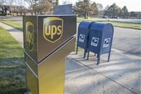 Chicago Illinois, USA - Circa 2020: An abstract representation of government versus privately owned companies.A USPS and UPS drop off location shown in a manor to reflect their fierce competition and rivalry. — Stock Editorial Photography