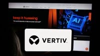 Stuttgart, Germany - 01-31-2025: Person holding cellphone with logo of US technology company Vertiv Holdings Co. on screen in front of business webpage. Focus on phone display. — Stock Editorial Photography