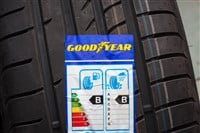 GDANSK, POLAND - MARCH 18, 2018. Brand new Goodyear car tyre with label with information about safety, fuel efficiency and external tyre noise. The Goodyear is an American multinational tire manufacturing company. — Stock Editorial Photography