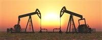 Oil pumps at sunset — Photo