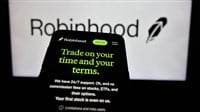 Stuttgart, Germany - 01-15-2025: Mobile phone with website of US financial company Robinhood Markets Inc. on screen in front of business logo. Focus on top-left of phone display. — Stock Editorial Photography