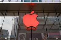 The logo of Apple Inc. is illuminated with red light to mark the World AIDS Day at the Apple Store on Nanjing Road shopping street in Shanghai, China, 30 November 2018. — Stock Editorial Photography