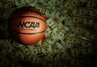 Eveleth, MN - USA - 03-08-2022: An NCAA Final Four Edition basketball surrounded by money