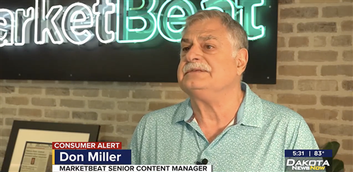 Don Miller in front of MarketBeat sign