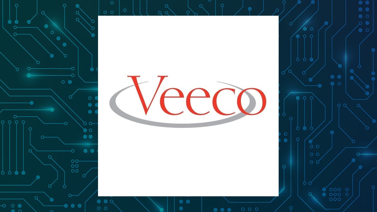 Veeco Instruments logo with Computer and Technology background